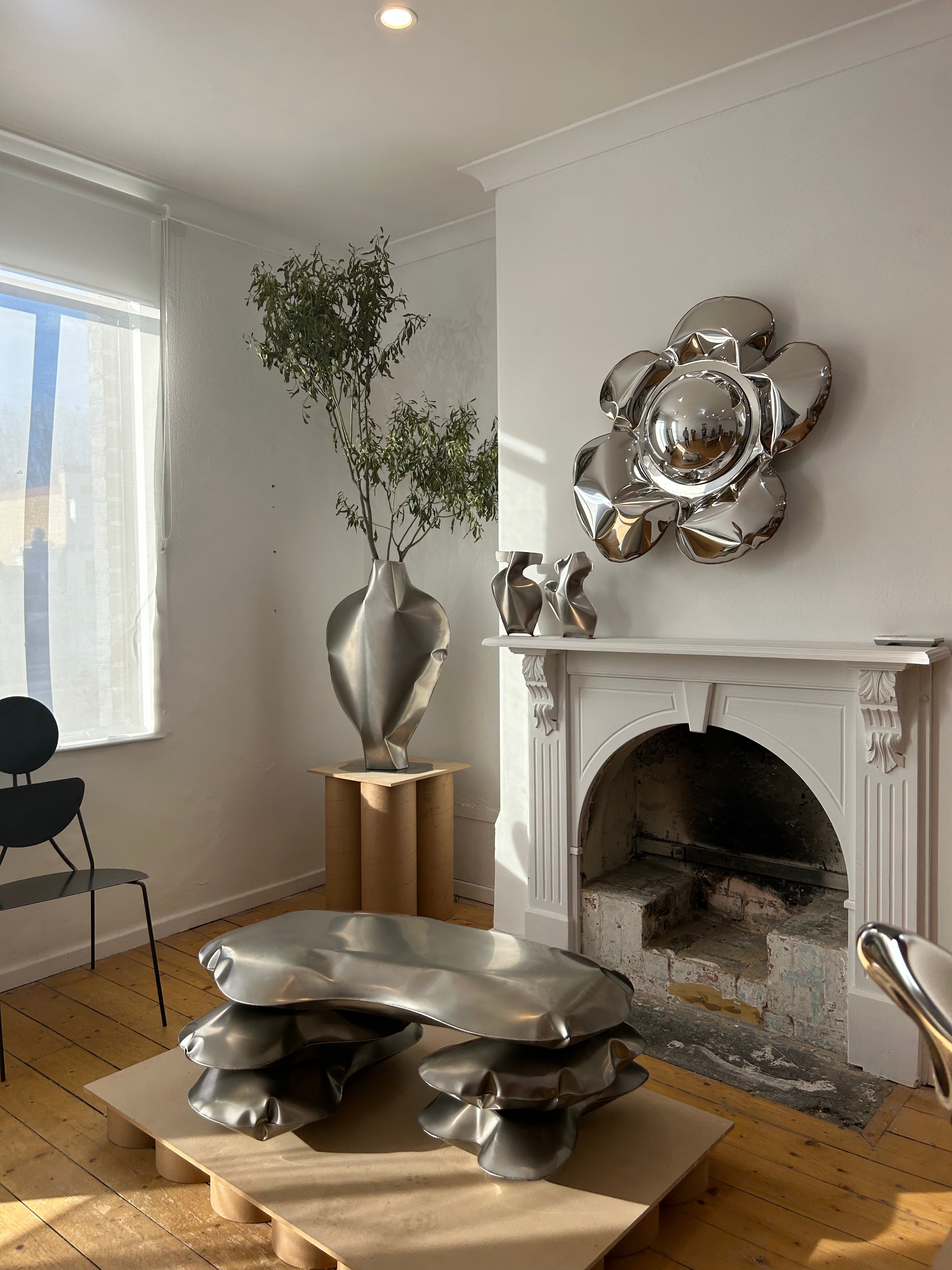 Contemporary reflective steel sculpture