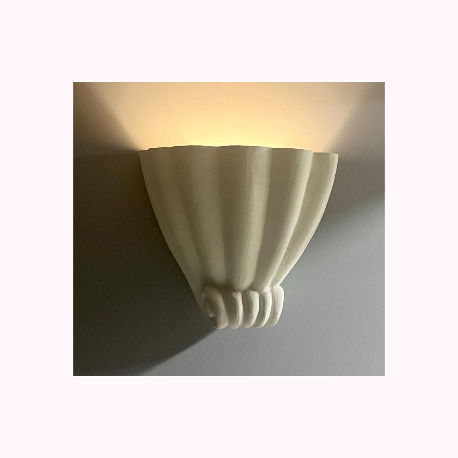 Custom-wired plaster scroll wall lamp for interiors