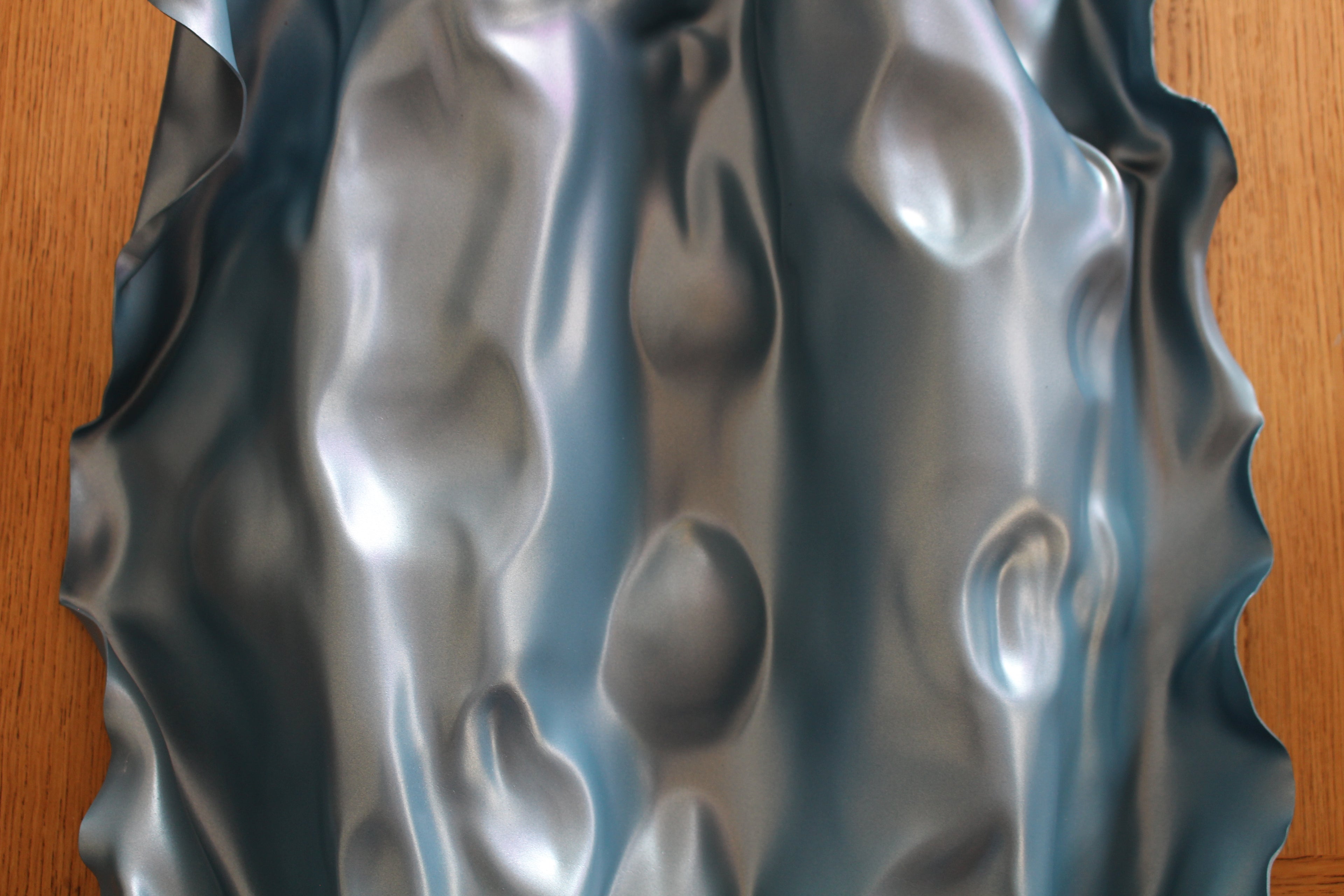 Unique blue resin art piece by Mariel