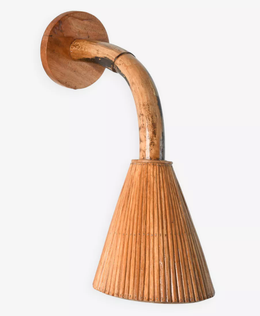 Handcrafted wicker wall sconce for boho interiors