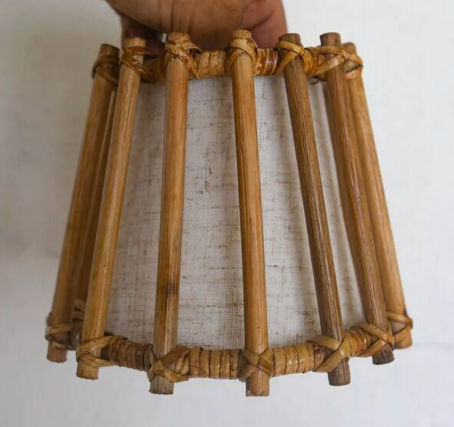 French-inspired wicker wall sconce with gold frame