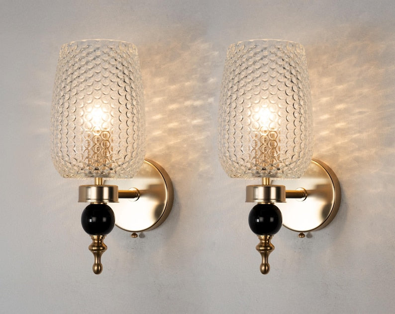 Black and gold Deco Murano sconce pair, illuminated