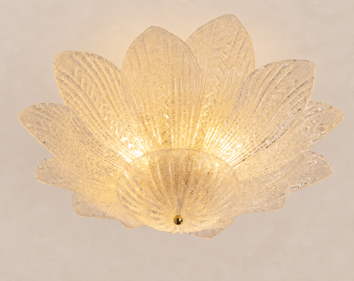 Clear grit Murano glass leaf ceiling light on pale stone background