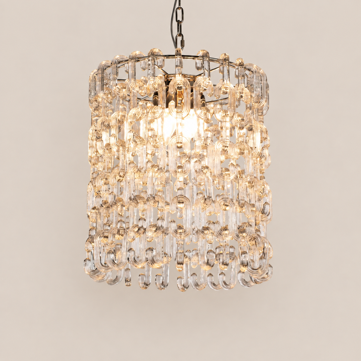 Clear Murano glass chain chandelier on stone background