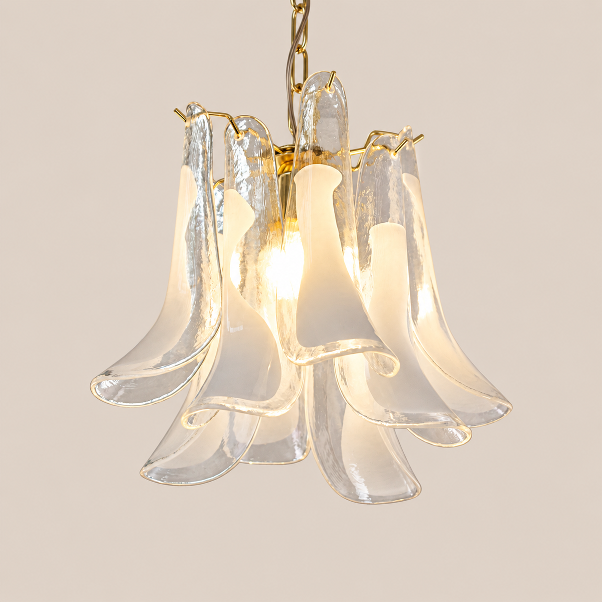 Compact Petali Murano glass pendant form on stone background
