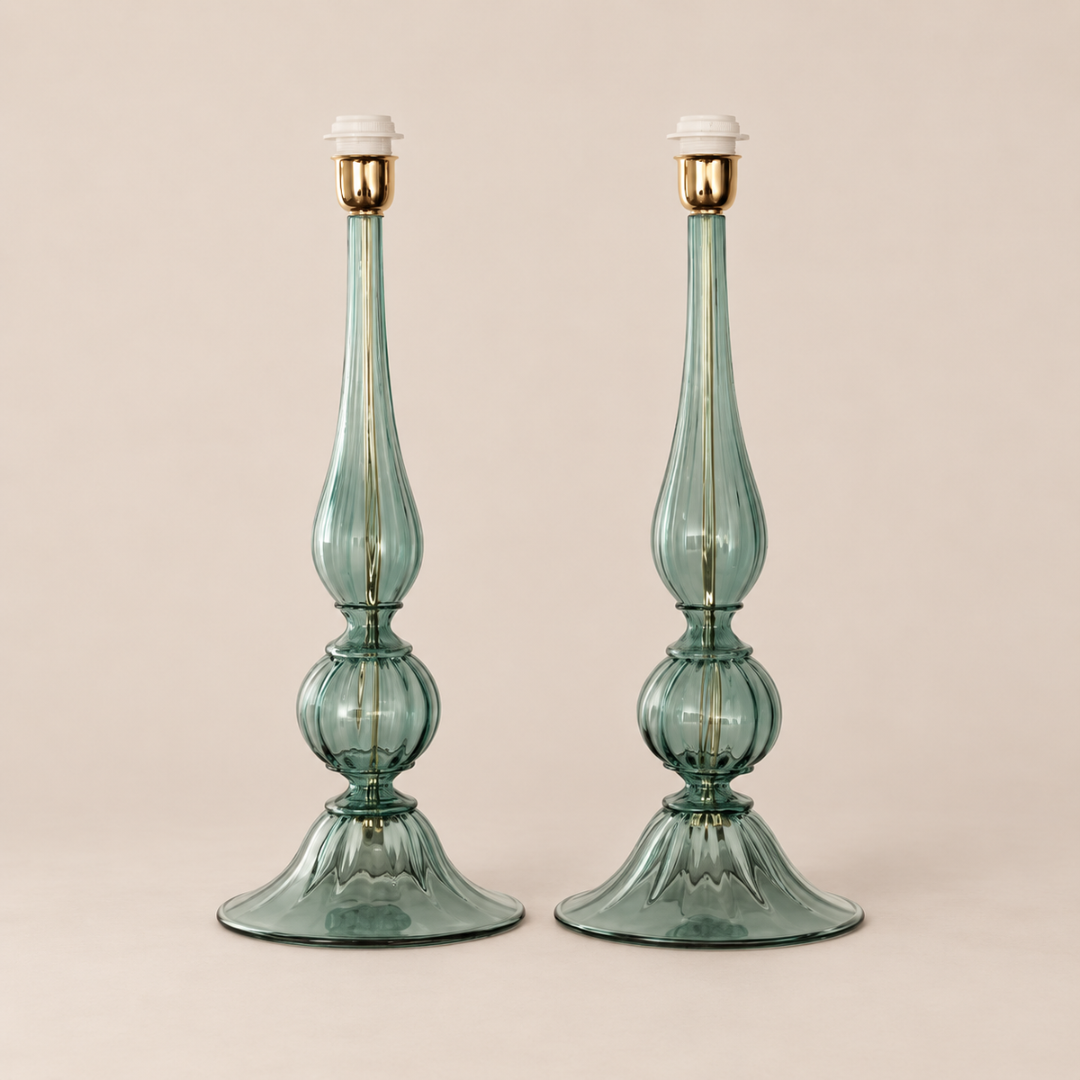 Pair of Rialto green Murano glass table lamps on stone background