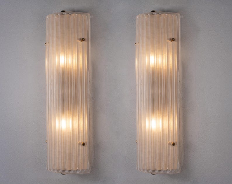 Pair of ribbed frosted Murano wall sconces illuminated